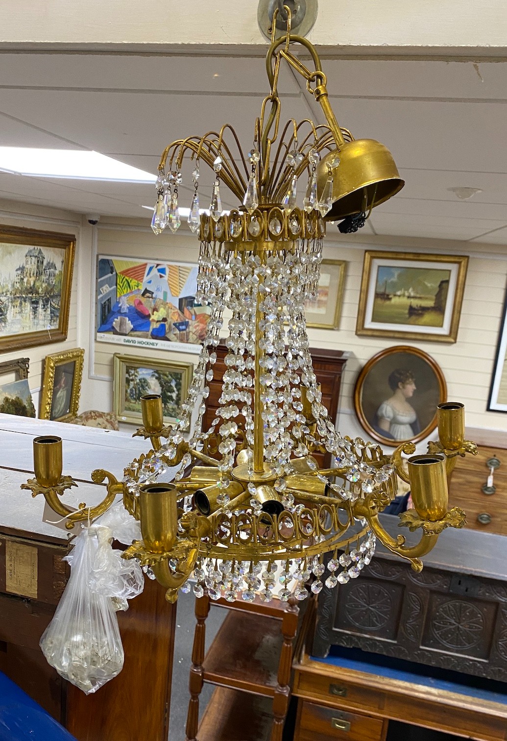 A brass and cut glass ceiling chandelier
